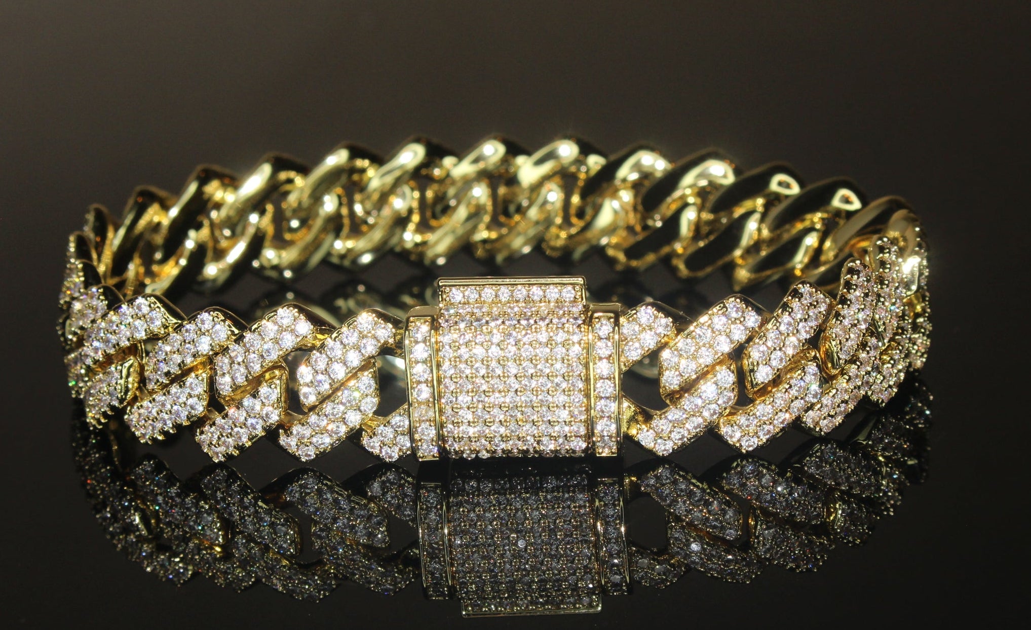 Gold and diamond bracelet on a black background